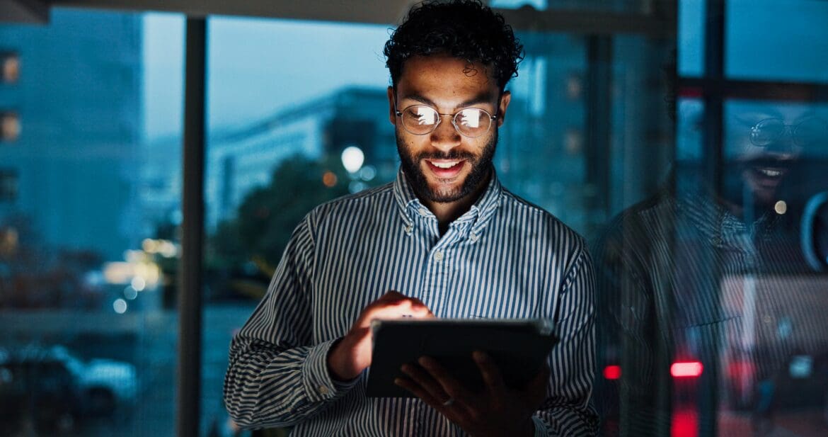 Young professional checking ETF investments in a Stocks and Shares ISA before the tax year end deadline